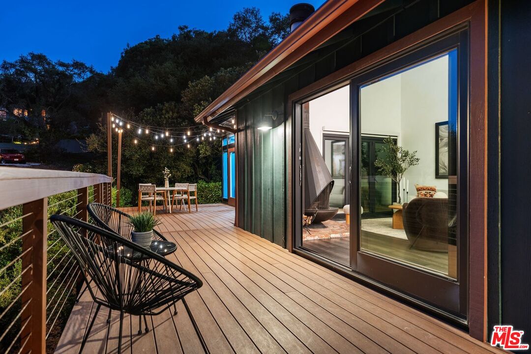 19806 Valley View Drive Topanga, CA 90290 - Photo 64 of 66 a view of a balcony with furniture and wooden floor