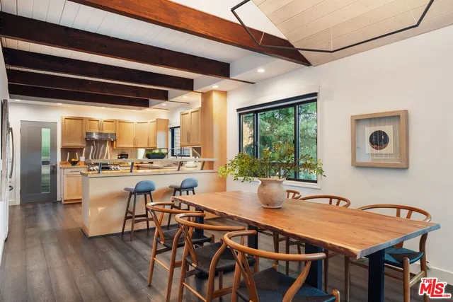 a outdoor dining space with furniture and window