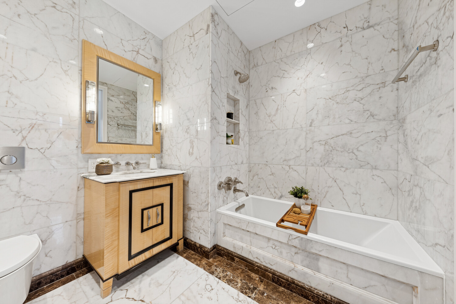 27 East 79th Street, Unit DUPLEX7/8 Manhattan, NY 10075 - Photo 17 of 20 a bathroom with a sink a toilet and a bathtub