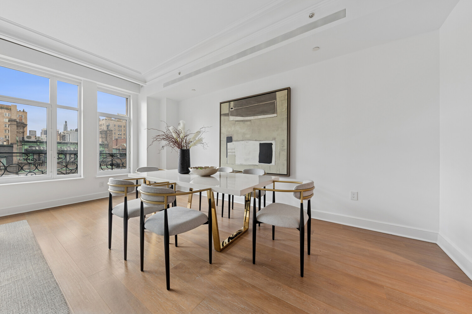 27 East 79th Street, Unit DUPLEX7/8 Manhattan, NY 10075 - Photo 3 of 20 a view of a dining room with furniture and wooden floor