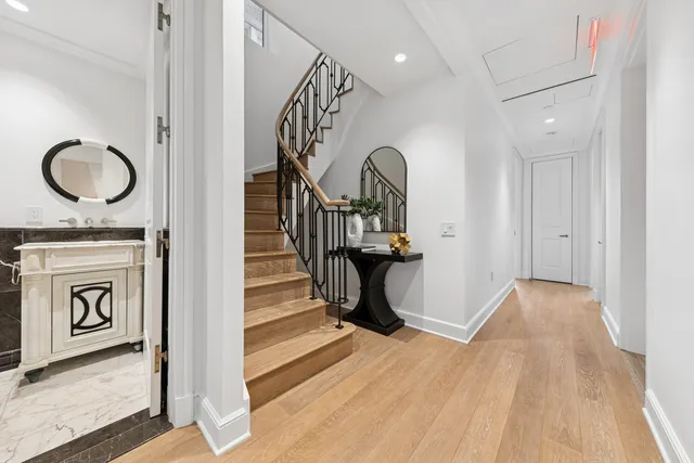 a kitchen with stainless steel appliances granite countertop lots of counter top space and wooden floor