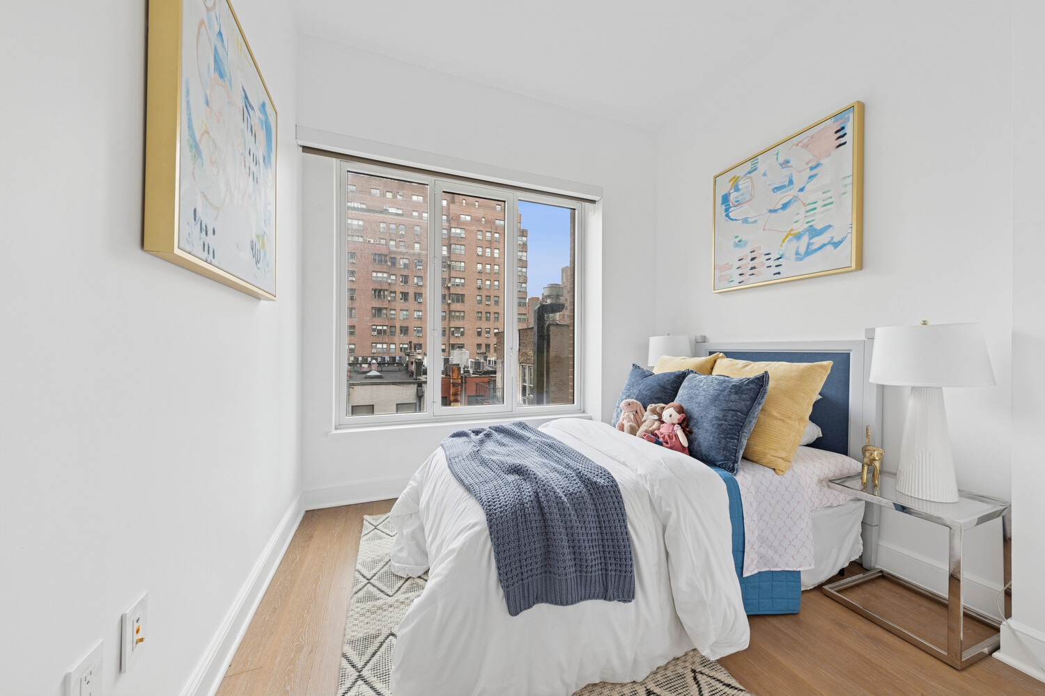 27 East 79th Street, Unit DUPLEX7/8 Manhattan, NY 10075 - Photo 7 of 20 a bedroom with a bed and a large window