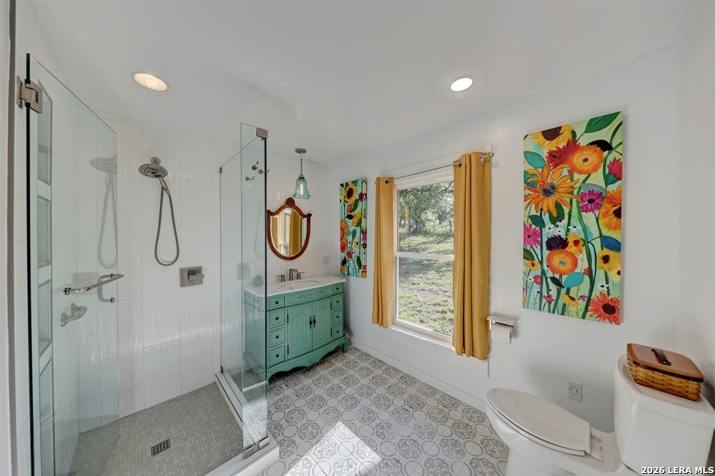 283 2nd Street Harper, TX 78631 - Photo 12 of 46 a bathroom with a shower and a sink