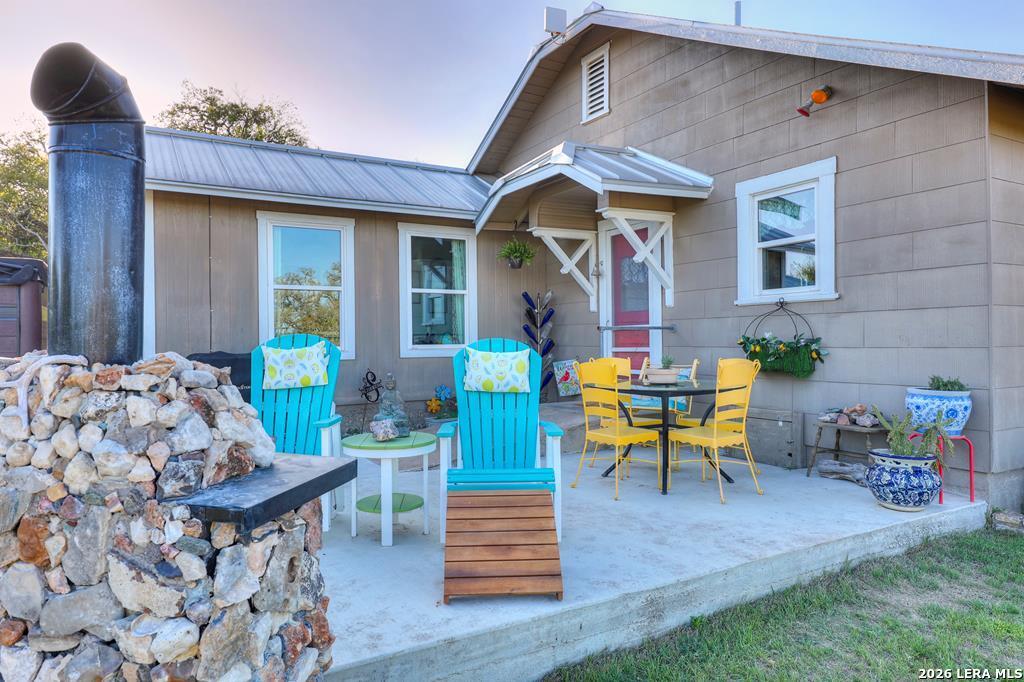 283 2nd Street Harper, TX 78631 - Photo 26 of 46 a front view of a house with outdoor seating