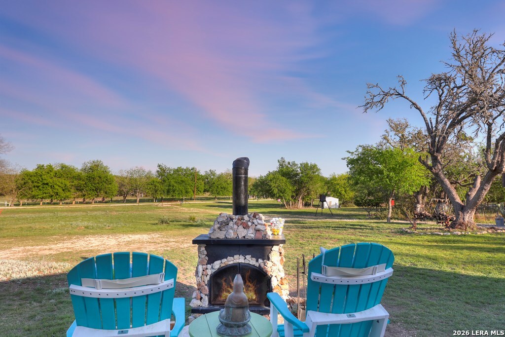 283 2nd Street Harper, TX 78631 - Photo 27 of 46 a swimming pool with outdoor seating and yard