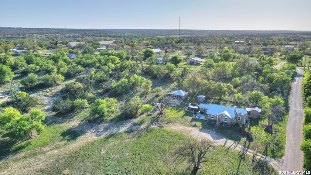 283 2nd Street Harper, TX 78631 - Photo 45 of 46 an aerial view of residential houses with outdoor space and trees