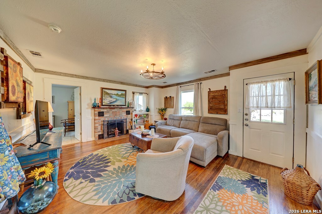 283 2nd Street Harper, TX 78631 - Photo 7 of 46 a living room with furniture and a fireplace