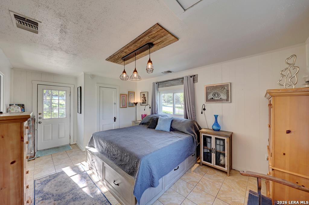 283 2nd Street Harper, TX 78631 - Photo 10 of 46 a bedroom with a bed and a window