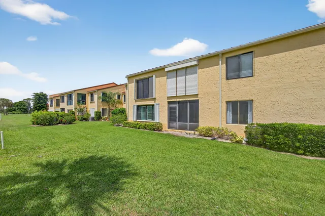 a view of a swimming pool with chairs