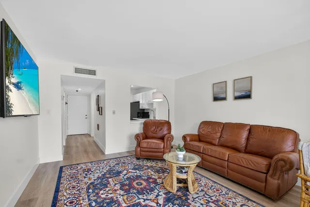 a living room with furniture rug and couch