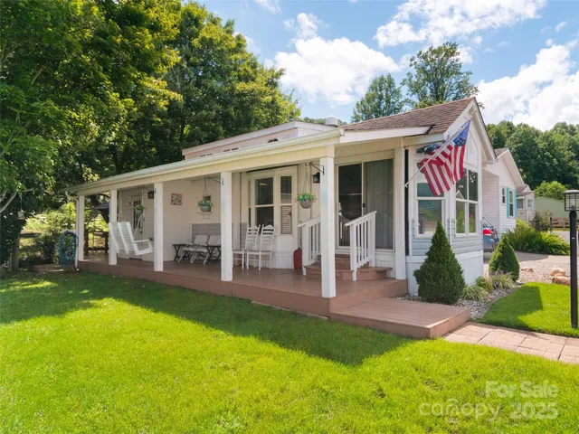 a view of a house with a yard patio and a patio