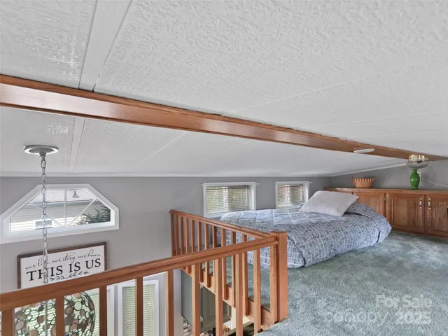 a bedroom with furniture and a window