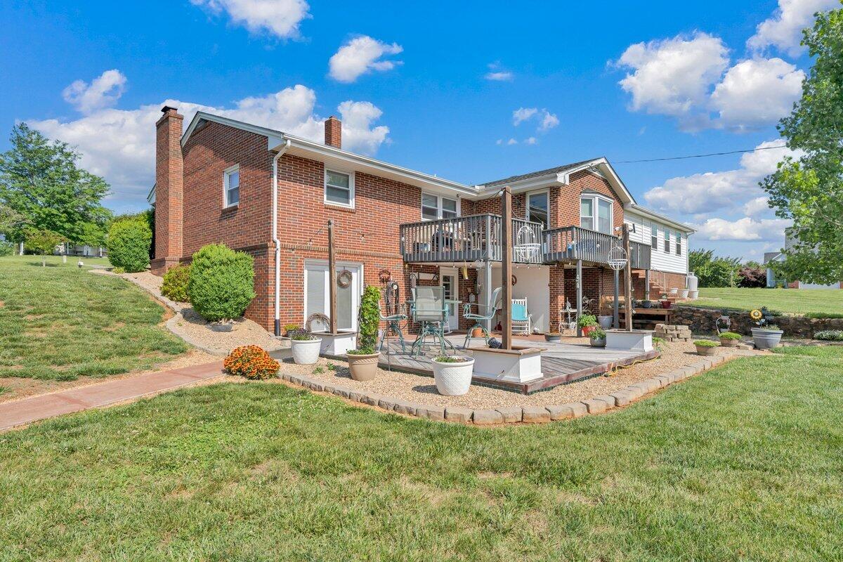 3226 Rakes Road Rocky Mount, VA 24151 - Photo 63 of 74 a front view of a house with garden and sitting area