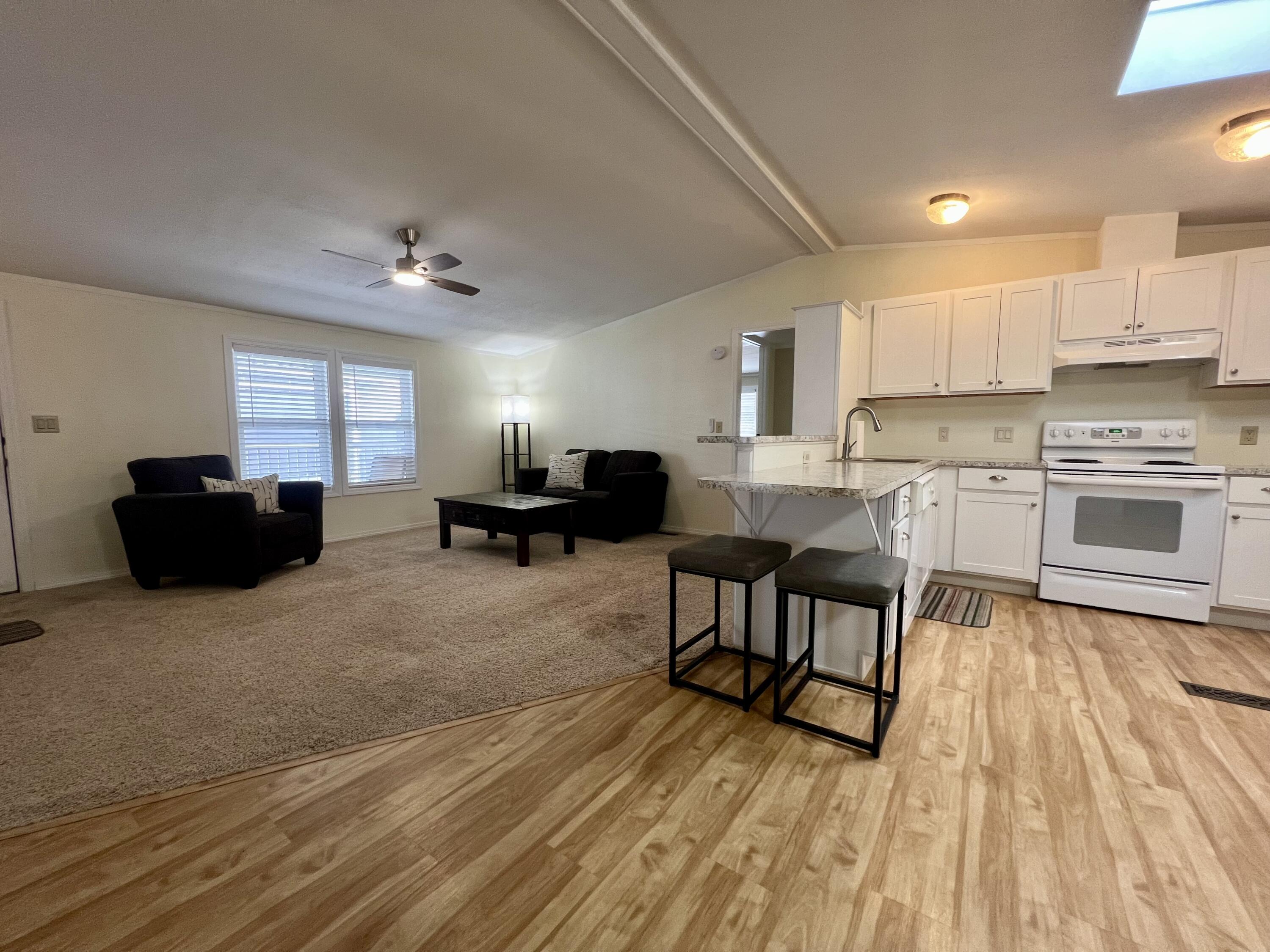 255 Colver Road, Unit 85 Talent, OR 97540 - Photo 4 of 28 living room and breakfast bar