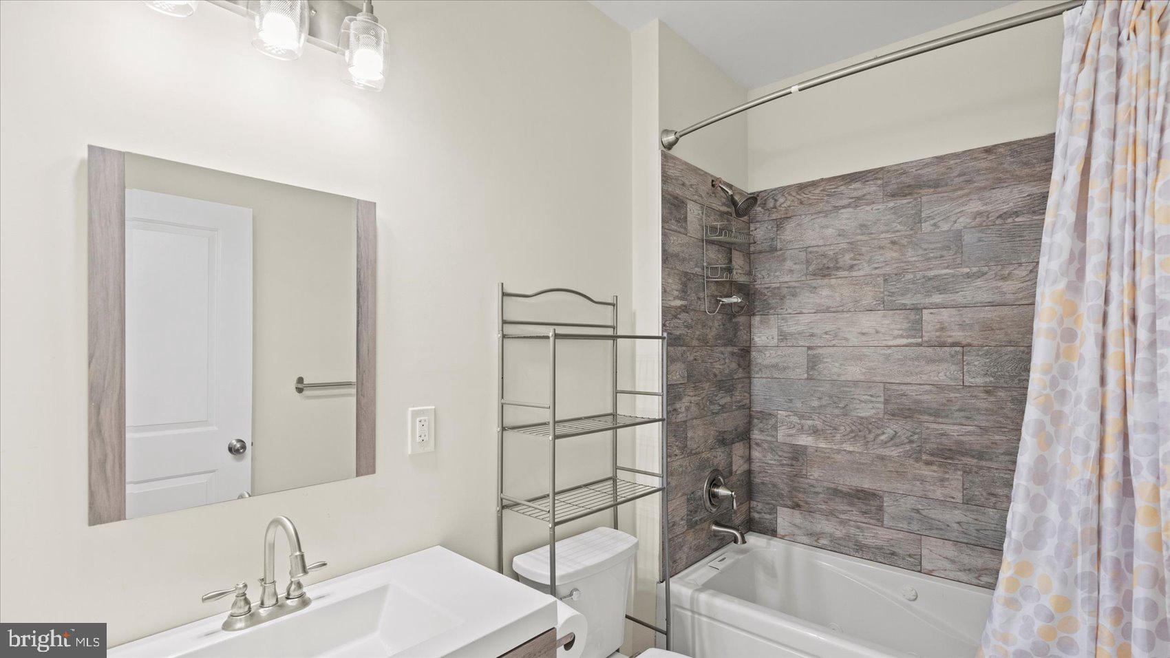 3145 Baybriar Road Dundalk, MD 21222 - Photo 45 of 54 a bathroom with a bathtub and a sink