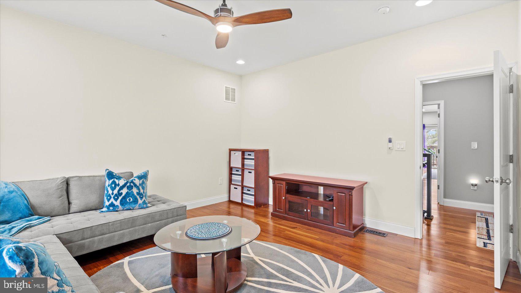 3145 Baybriar Road Dundalk, MD 21222 - Photo 46 of 54 a living room with furniture and a wooden floor