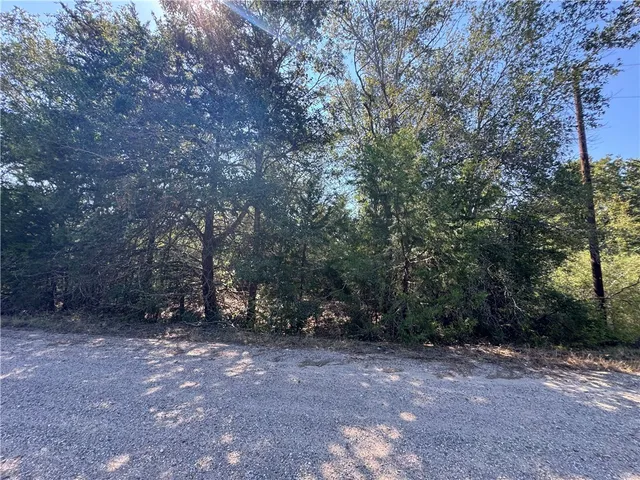 a view of lake with green space
