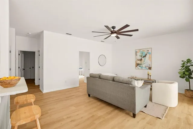 a living room with furniture and a table