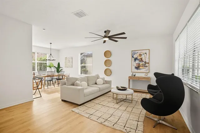 a living room with furniture and a large window