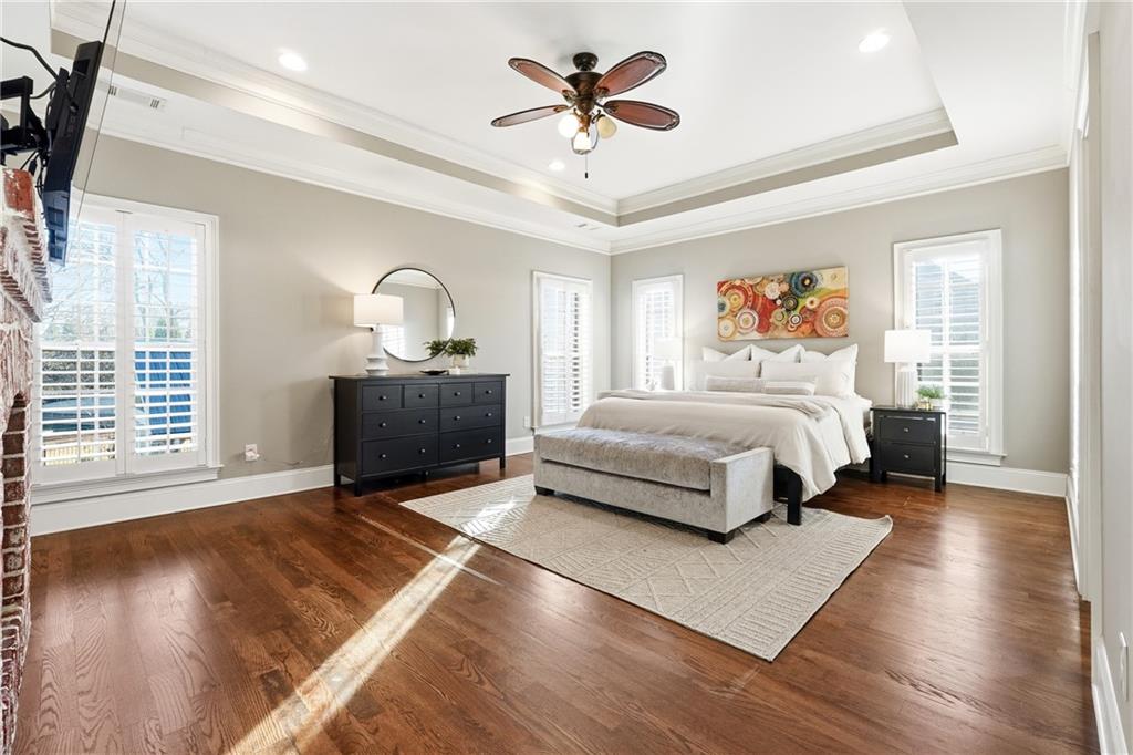 18 Starlight Drive Cartersville, GA 30121 - Photo 21 of 74 a bedroom with a bed and a chandelier