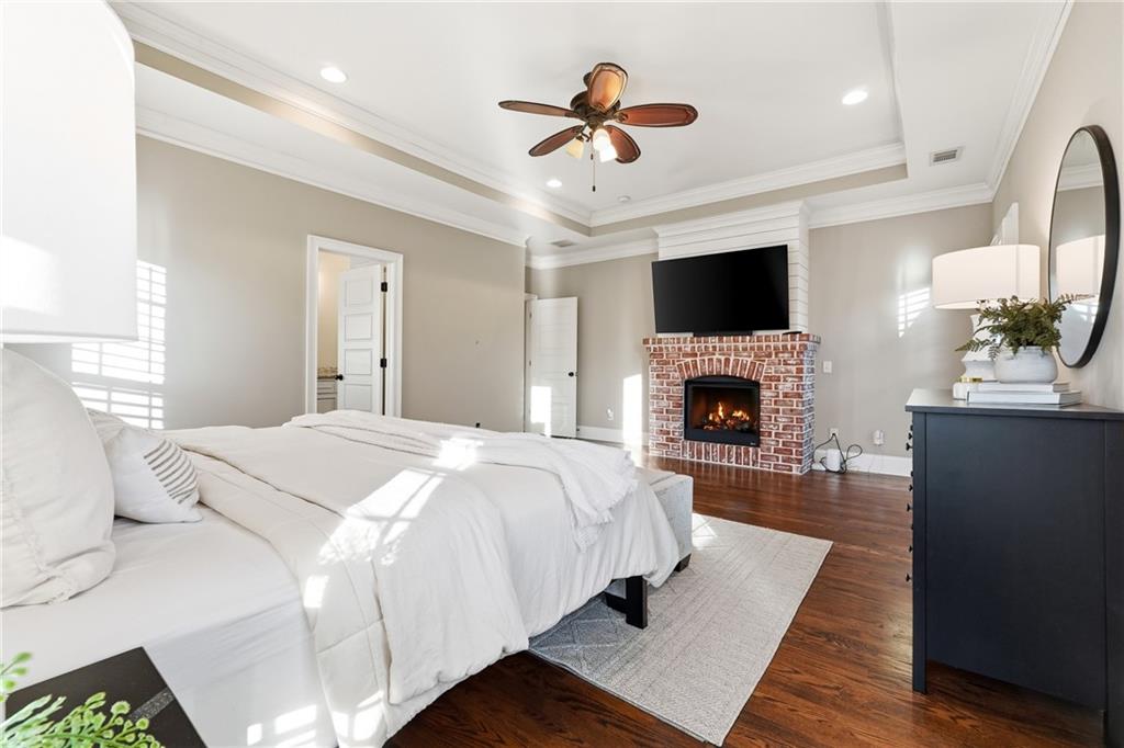 18 Starlight Drive Cartersville, GA 30121 - Photo 22 of 74 a bedroom with a bed and a fireplace