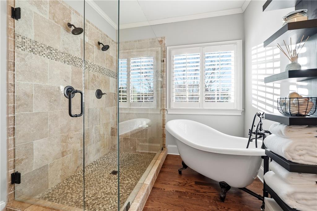 18 Starlight Drive Cartersville, GA 30121 - Photo 25 of 74 a bathroom with a tub a sink and a shower