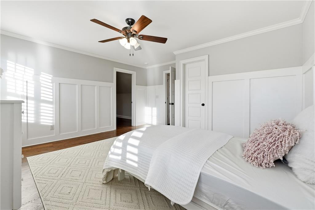 18 Starlight Drive Cartersville, GA 30121 - Photo 37 of 74 a bedroom with a large bed and a chandelier