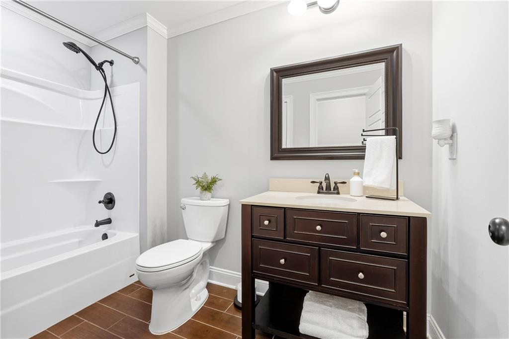 18 Starlight Drive Cartersville, GA 30121 - Photo 50 of 74 a bathroom with a sink vanity mirror and toilet