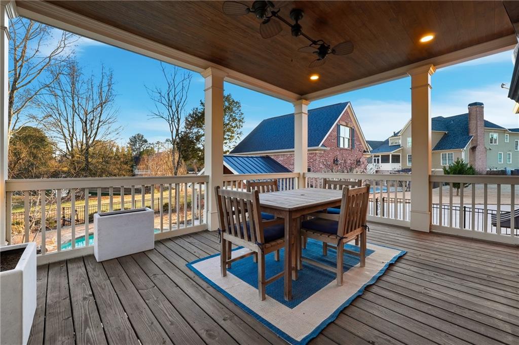18 Starlight Drive Cartersville, GA 30121 - Photo 54 of 74 a view of a roof deck with table and chairs a barbeque with wooden floor and fence