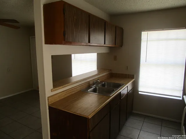 a kitchen with a stove and a microwave