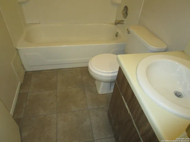 a bathroom with a sink and toilet