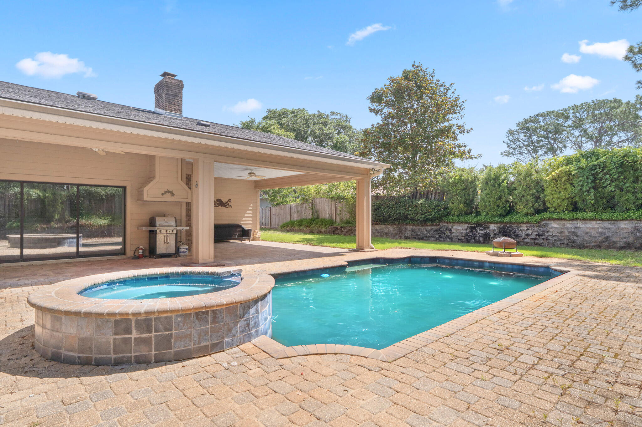 12 Hillcrest Drive Shalimar, FL 32579 - Photo 1 of 45 a view of a swimming pool with a sitting space