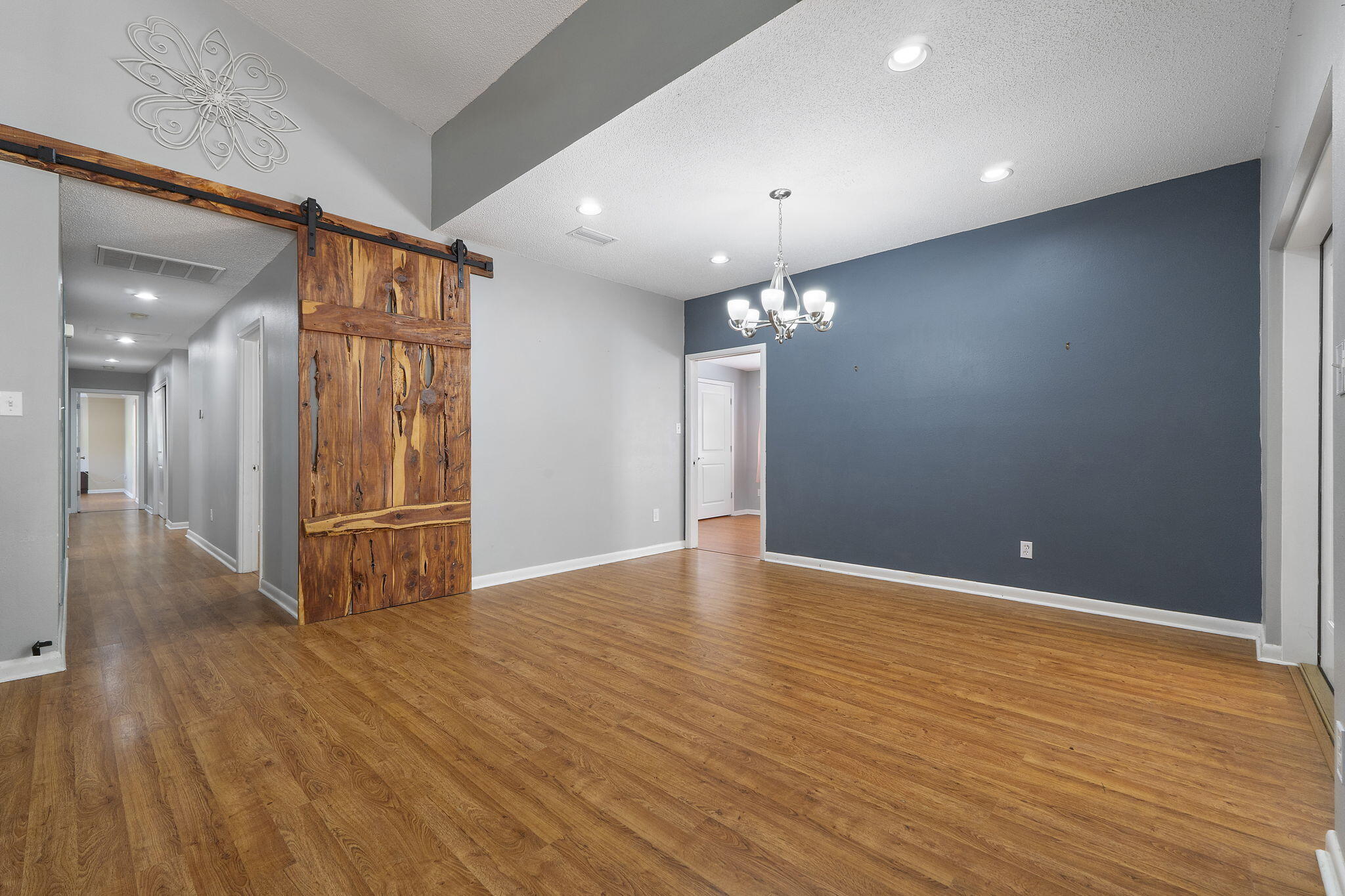 12 Hillcrest Drive Shalimar, FL 32579 - Photo 13 of 45 a view of a livingroom with a ceiling fan window and wooden floor
