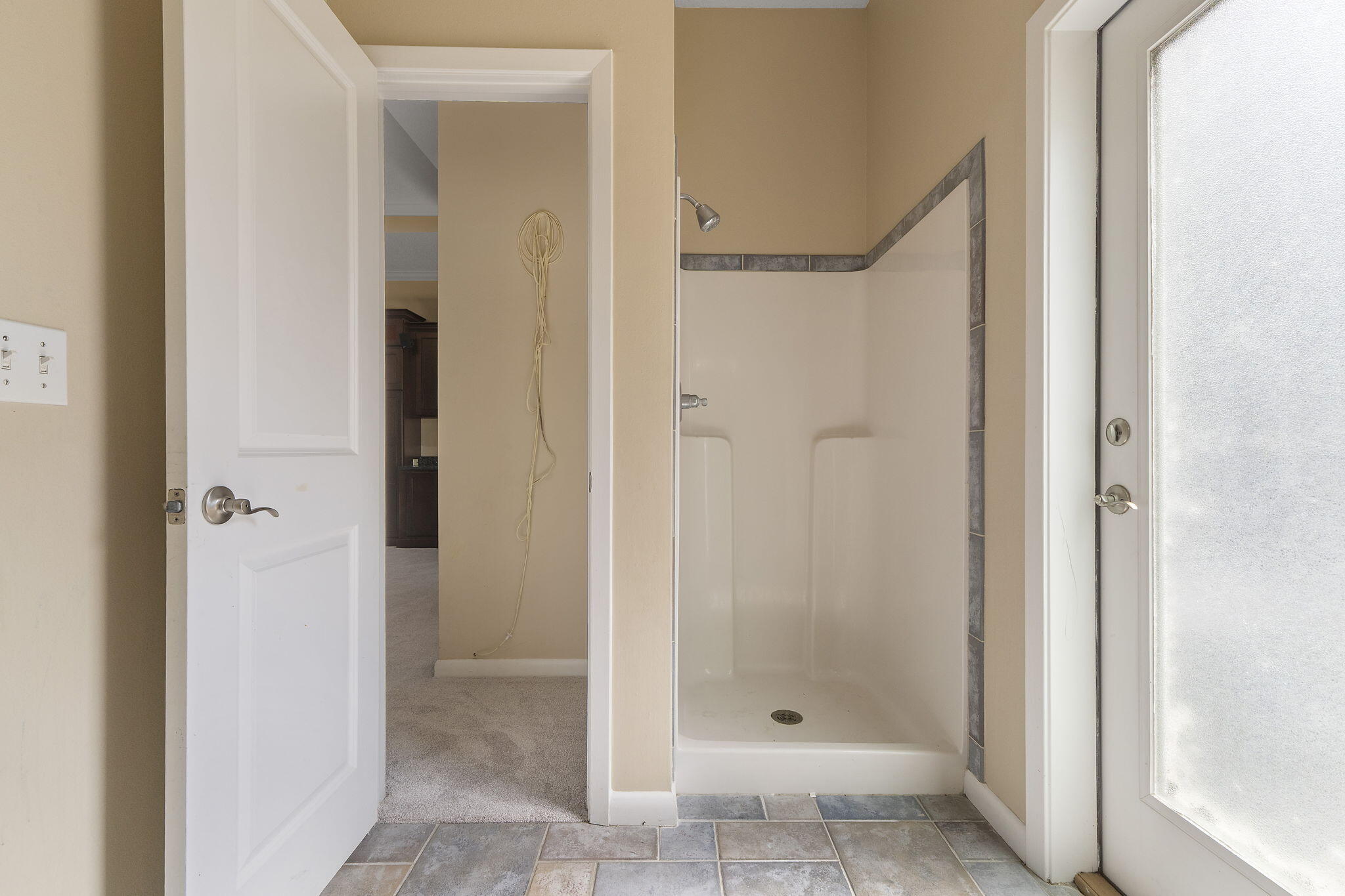 12 Hillcrest Drive Shalimar, FL 32579 - Photo 16 of 45 a bathroom with a glass shower door