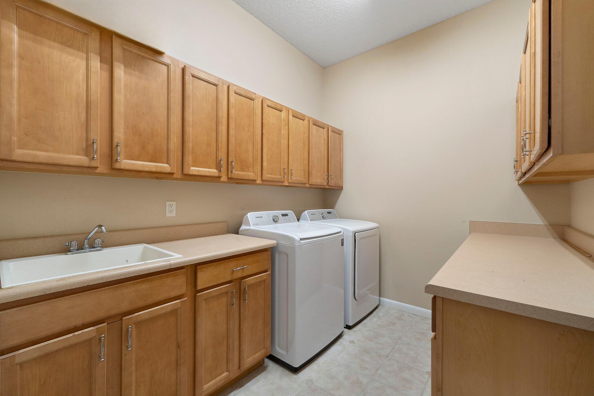 12 Hillcrest Drive Shalimar, FL 32579 - Photo 18 of 45 a utility room with a sink washer and dryer