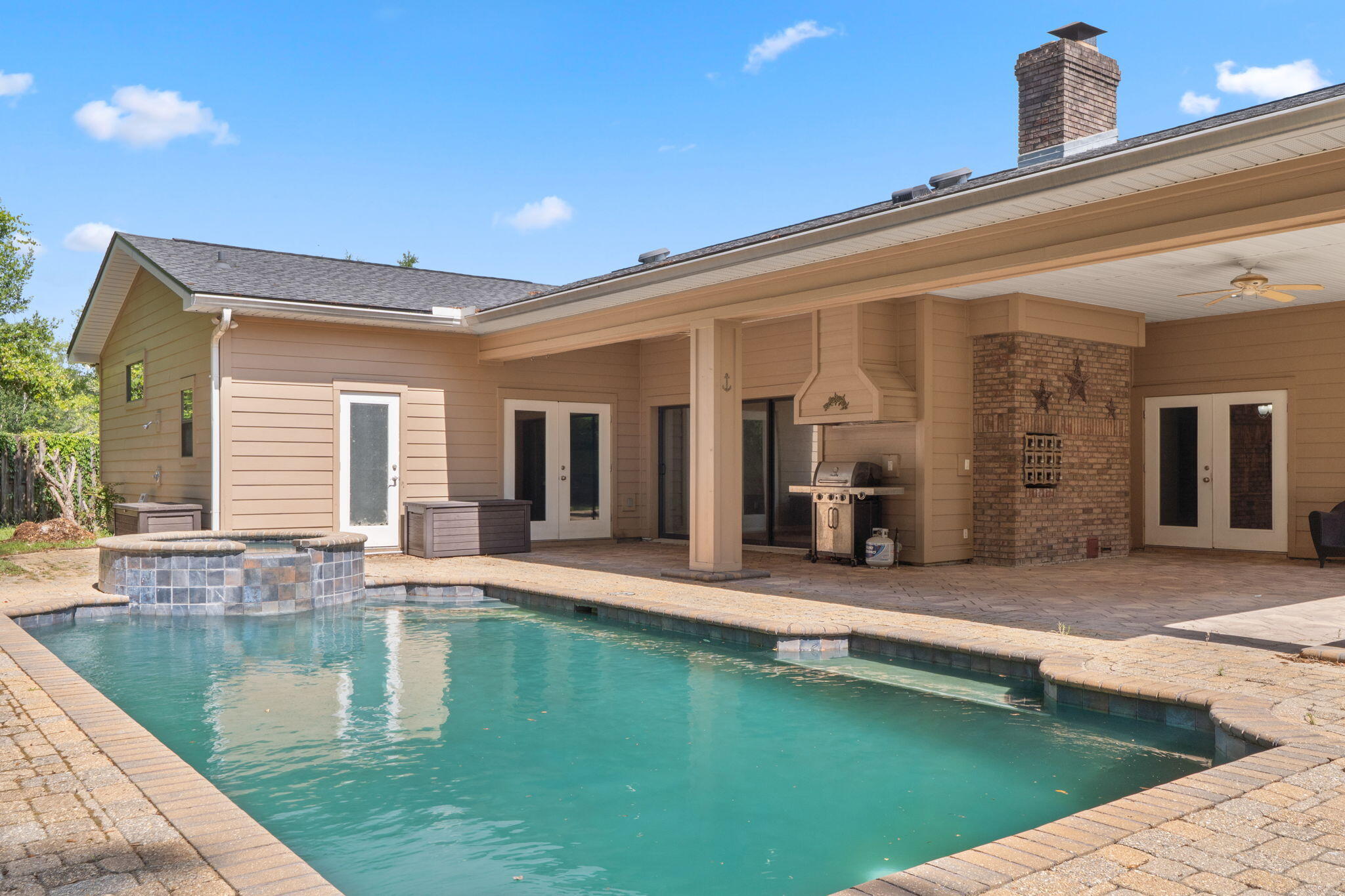 12 Hillcrest Drive Shalimar, FL 32579 - Photo 2 of 45 a view of a patio with swimming pool table and chairs