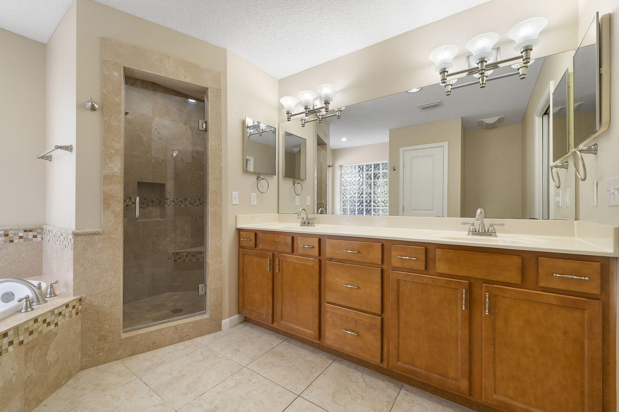 12 Hillcrest Drive Shalimar, FL 32579 - Photo 22 of 45 a spacious bathroom with a shower sink mirror and