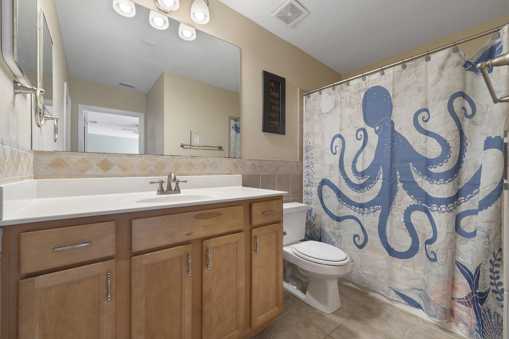 12 Hillcrest Drive Shalimar, FL 32579 - Photo 26 of 45 a bathroom with a toilet sink and mirror