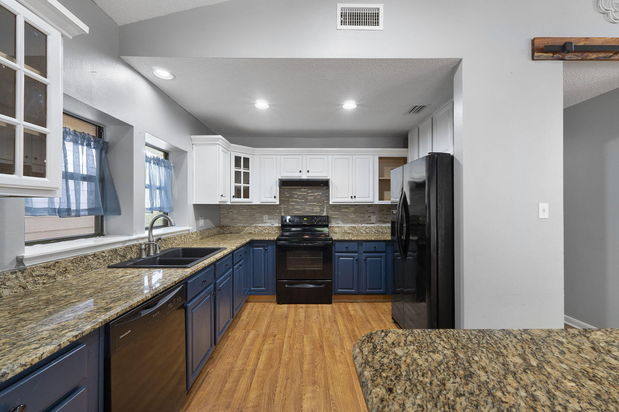 12 Hillcrest Drive Shalimar, FL 32579 - Photo 9 of 45 a kitchen with granite countertop stainless steel appliances and wooden cabinets