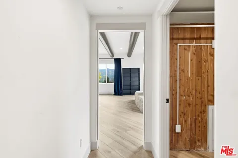 a spacious bathroom with a granite countertop sink and a mirror