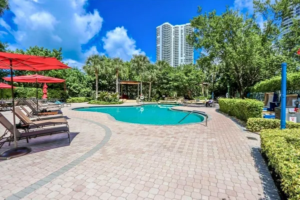 a view of a swimming pool with a patio