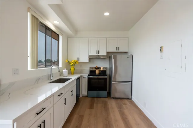 a bedroom with two beds and a window