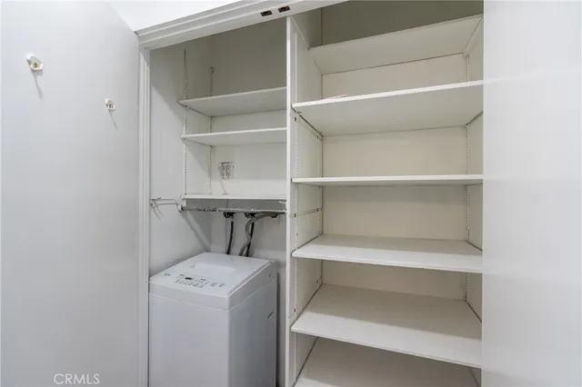 a view of a patio with a table and chairs