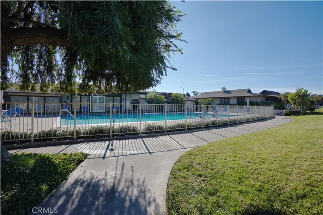 a view of a field with of cars parked