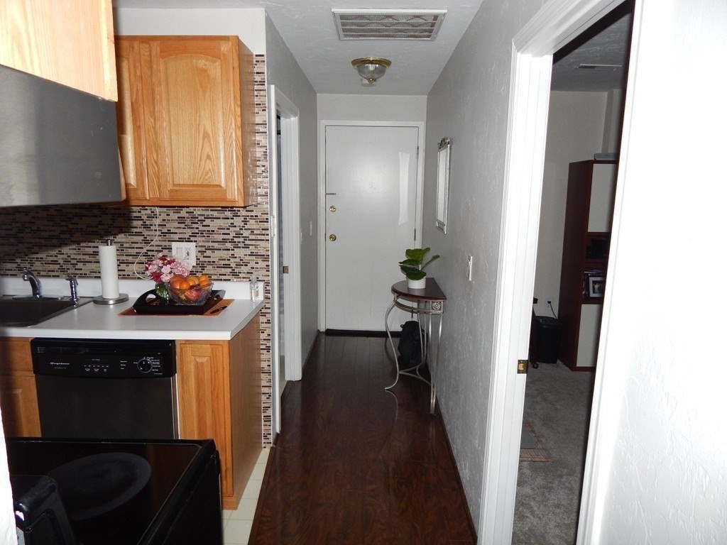 17 Federal Street, Unit 506 Worcester, MA 01608 - Photo 11 of 17 a kitchen with a sink stove and refrigerator