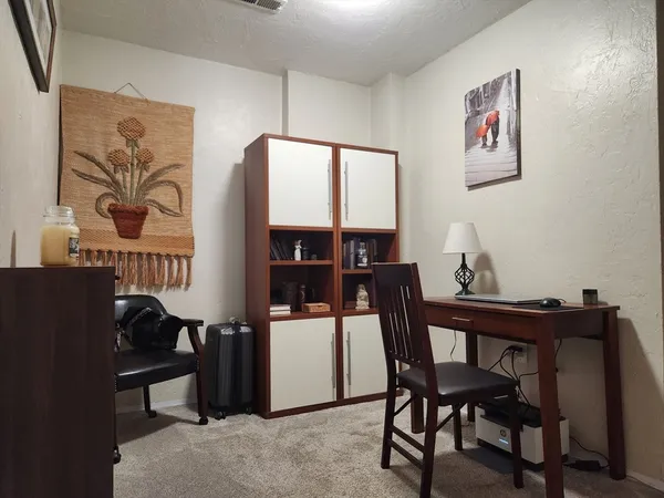 a dining room with furniture and window