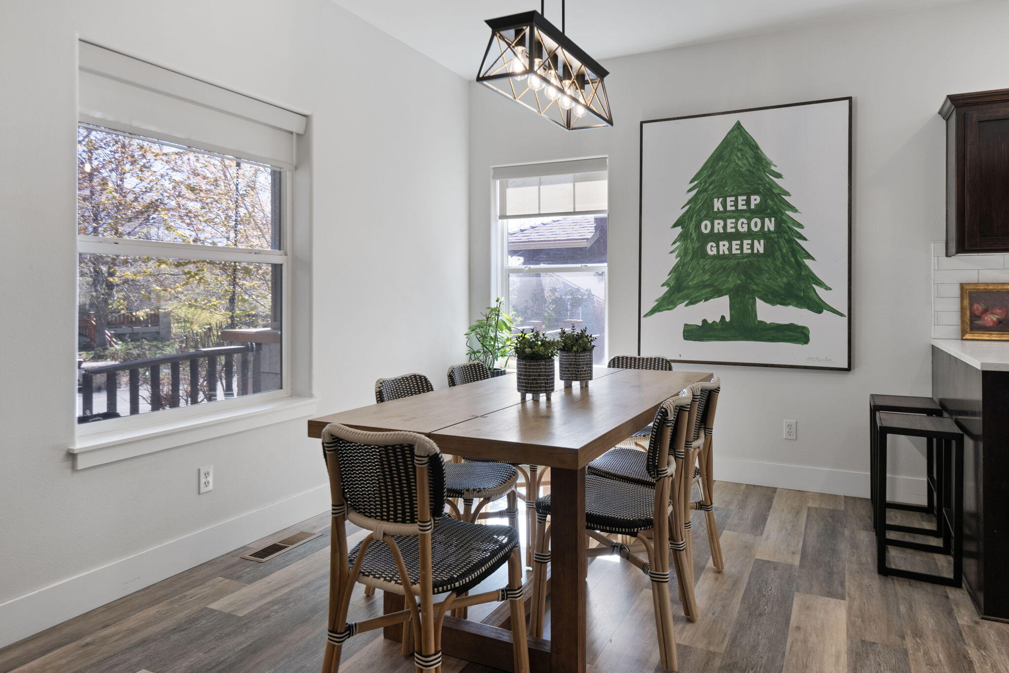 62744 Larkview Road Bend, OR 97701 - Photo 9 of 25 a view of a dining room with furniture window and wooden floor
