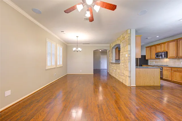 a view of kitchen with cabinets and wooden floor