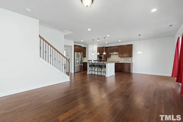 a view of kitchen with cabinets and wooden floor