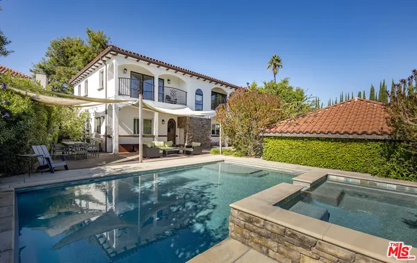 a front view of a house with swimming pool